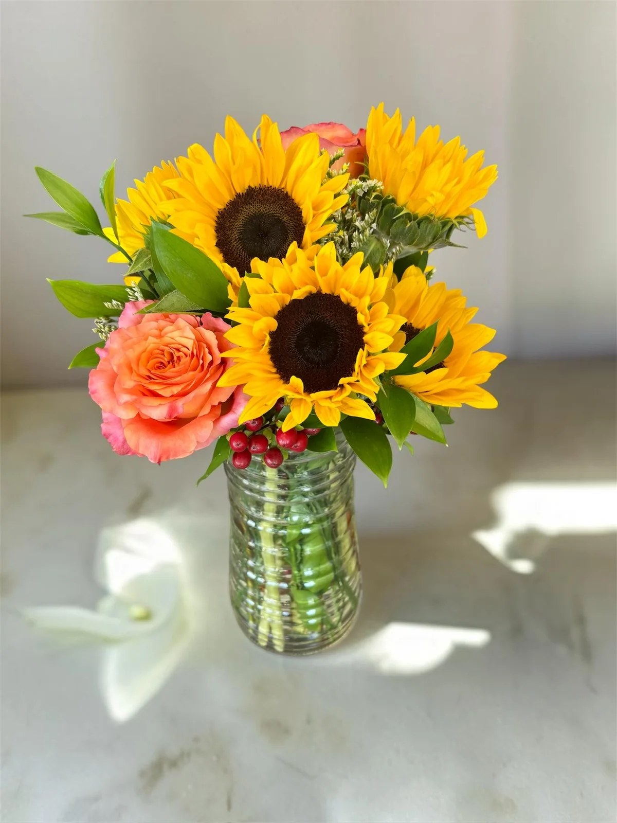 Bright sunflower sympathy arrangement created by a local Hilliard florist